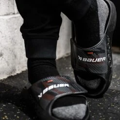 S23 Bauer OOFOS Sport Flex Slide Sandal 13 S23 Bauer OOFOS Sport Flex Slide Sandal -Rexhockey bauer oofos ng sport slide blk action 2